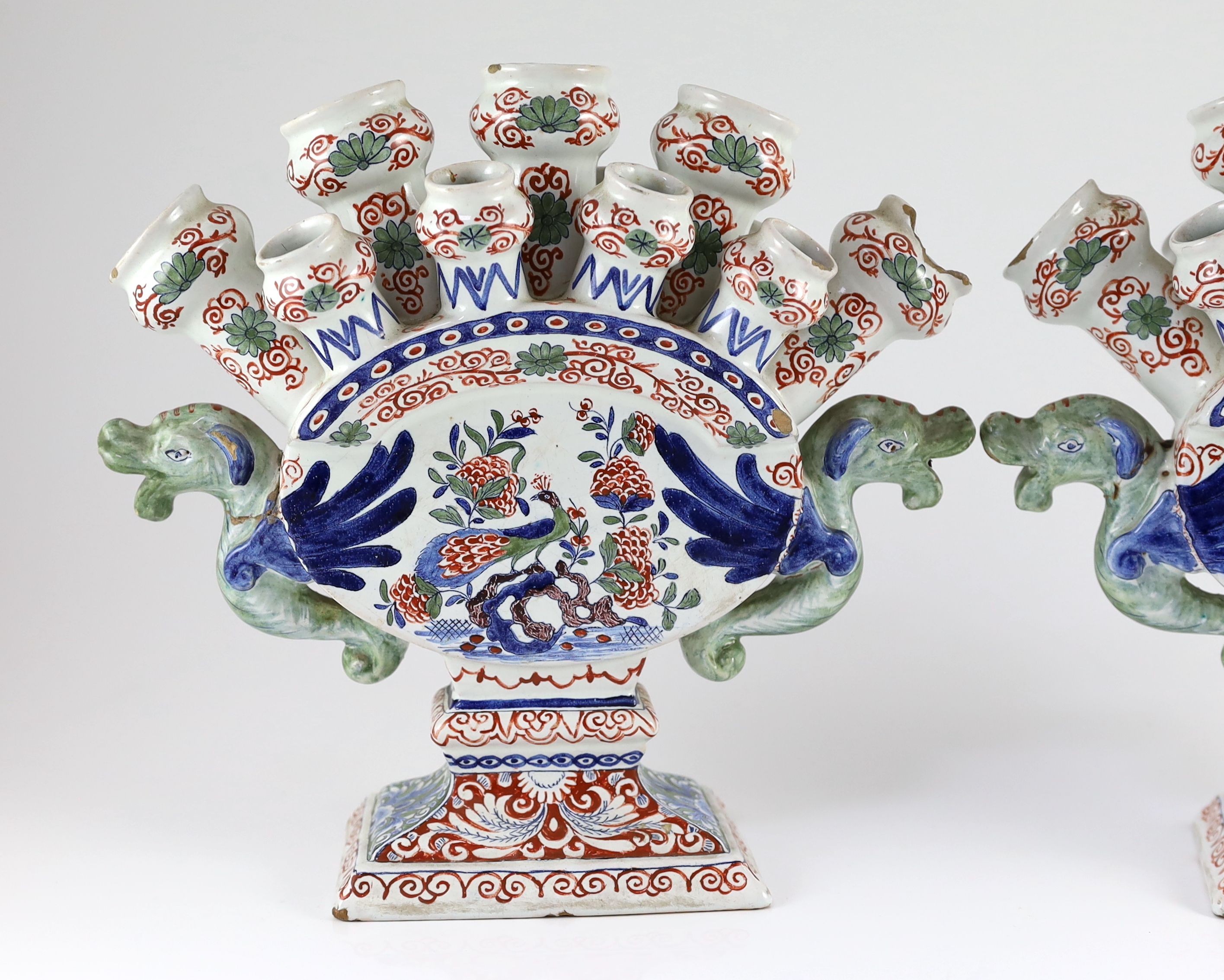 A pair of Delft polychrome multiple tulip vases, Lambertus van Eenhoorn, De Metaale Pot factory, c.1700-1720, 30cm high, 32cm wide